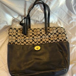 Coach black and tan handbag.